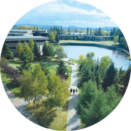 Aerial view of Lakehead University campus in Ontario, Canada, with green spaces, pathways and water feature in circular photo