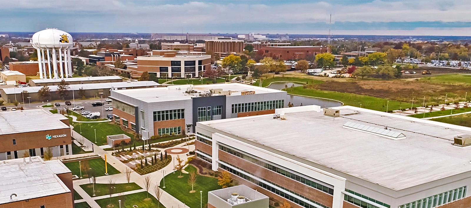 Aerial view of Wichita State University campus showing university buildings and water tower depicting WSU Shockers logo